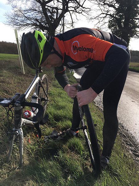 Gary struggling to fix a puncture